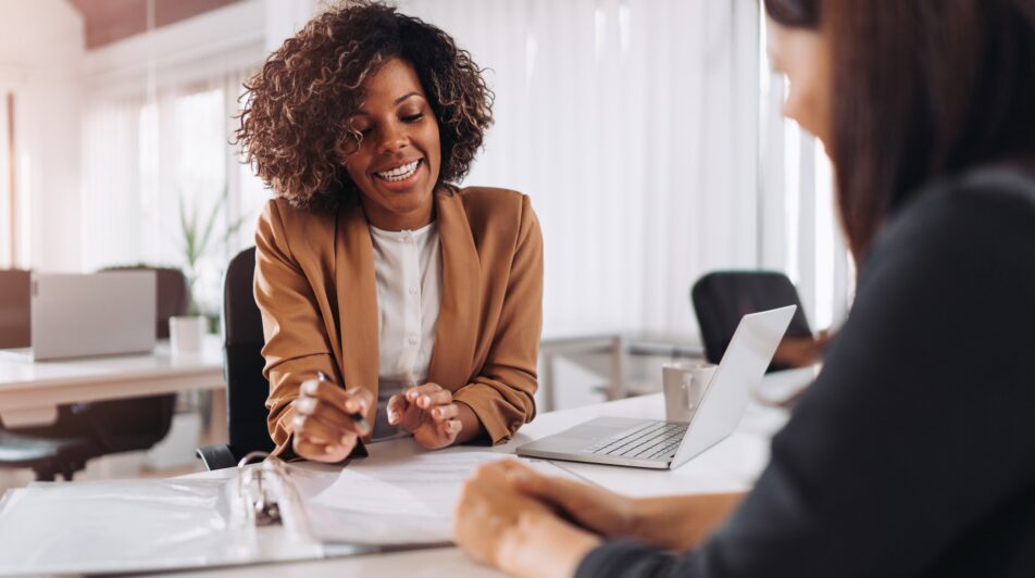 Female client consulting with a agent in the office